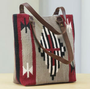 Sport a Western-style woven handbag that’s knitted in yarn and covered in hypnotic Aztec designs.