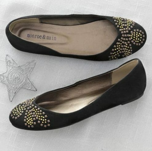 Black flats with beaded embellishments on toe