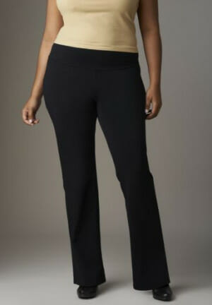 Woman in beige top, black pants and black shoes