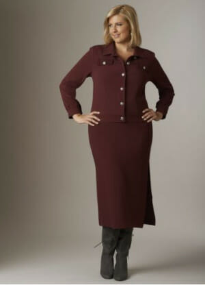 Woman in burgundy denim blazer and burgundy maxi skirt with tall gray boots