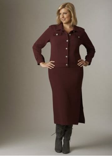 Monochromatic looks are another very flattering trend Woman in burgundy denim blazer and burgundy maxi skirt with tall gray boots