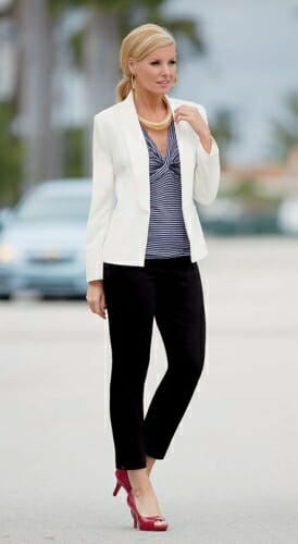 Woman in white blazer over blue and white stripe top, black pants and red pumps