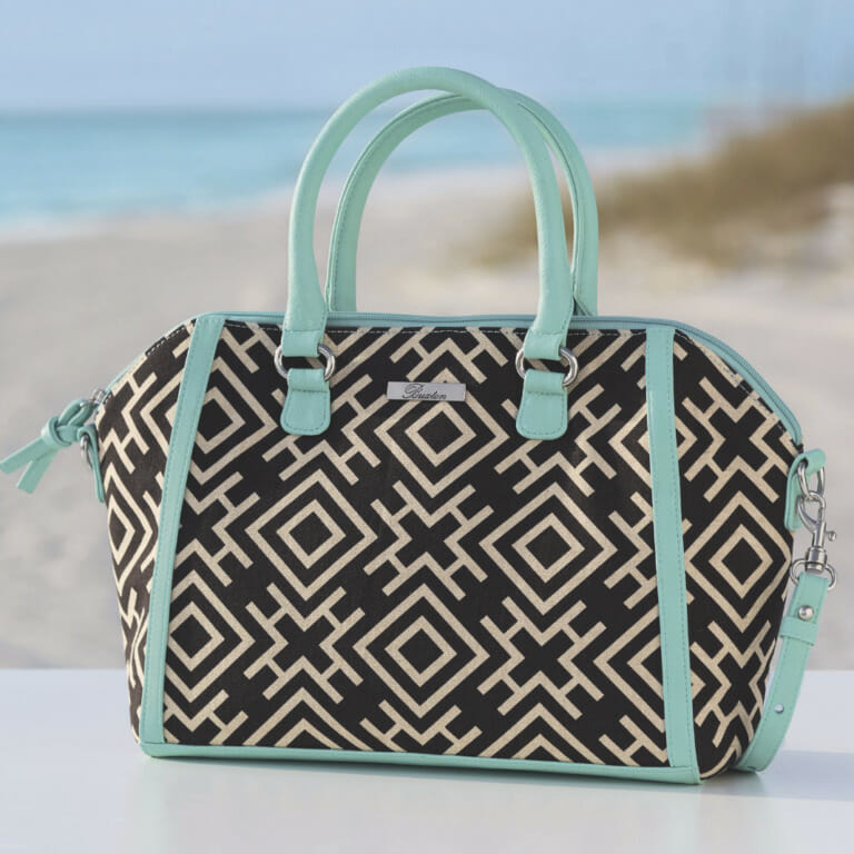 A beautiful tote or cross-body bag is the perfect addition to your summer wardrobe. Turquoise and black handbag