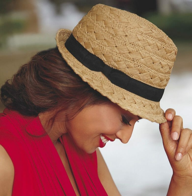 girl in box-weave hat with black ribbon around brim