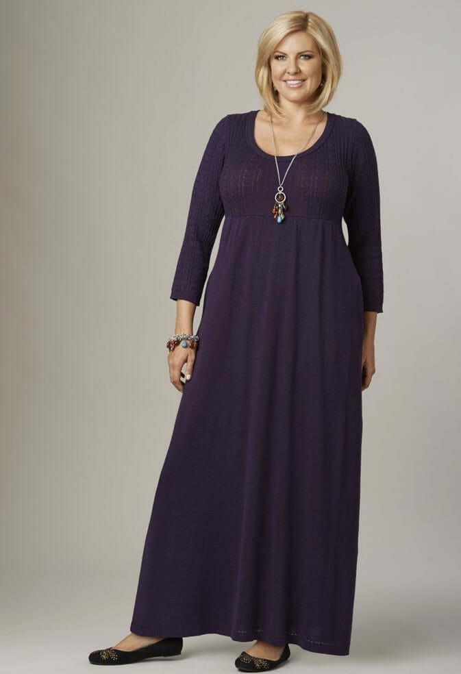 woman wearing a eggplant maxi dress and black flats