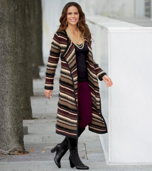 Woman wearing Gold Necklaces, black shirt, purple leggings and multi-stripe duster