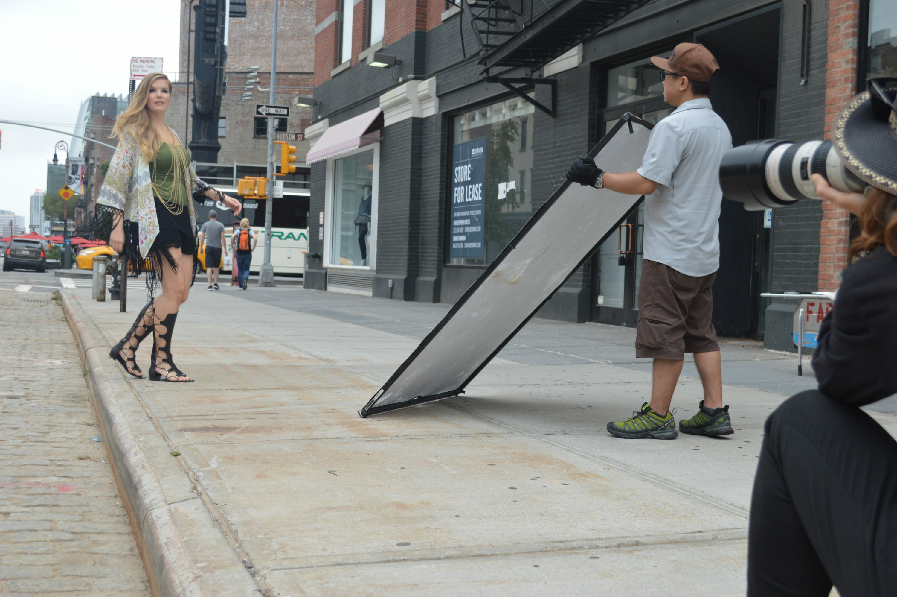 Photographer taking picture of model