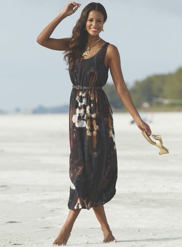 Slimming dark florals and a decorative back neckline tie command attention. Enhancing your feminine silhouette, a faux leather belt defines your shape. 53" long. Polyester; machine wash. Imported. Available only in Multi.