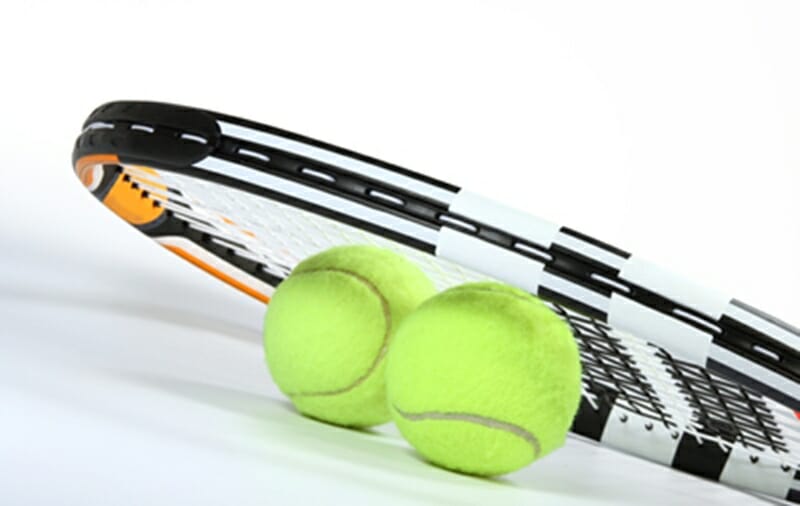 Tennis balls and racket