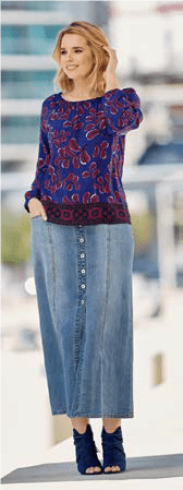 Woman in denim button down long skirt and multi-color top