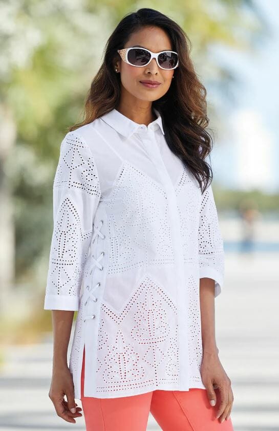 woman wearing peach leggings and white tunic with eyelet enhanced pattern