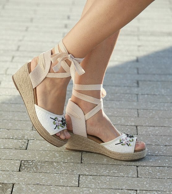 White, floral beading with fabric ties and basket weave strap on 2 1/2 inch wedge sandal