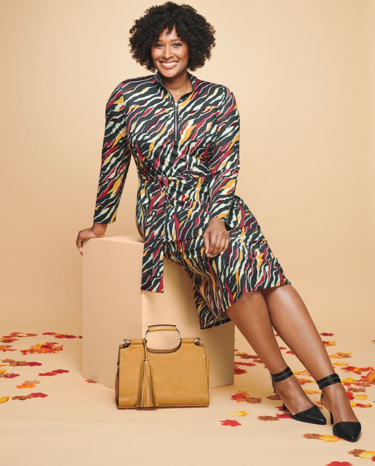 plus-size model wearing a printed zebra-colored dress