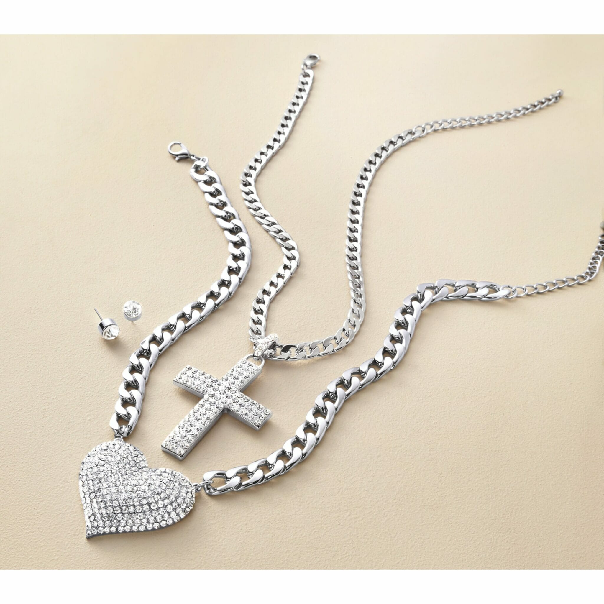 3-piece jewelry set with heart and cross necklace and earrings.