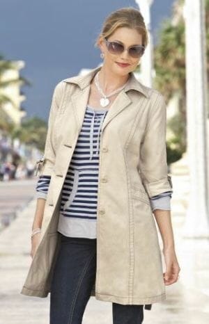 Try a knee-length trench coat made of water-resistant or waterproof material to keep you and your clothing dry.