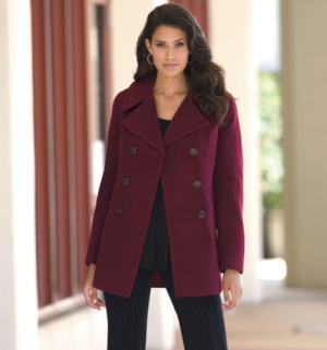 Woman in maroon pea coat over black top and black pants