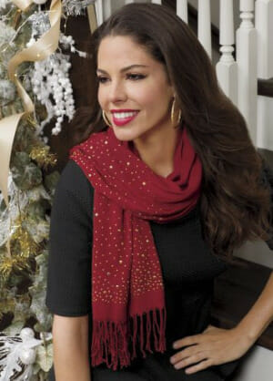 Wear a deep-red knit scarf to add style to a simple black coat and stay warm at the same time.