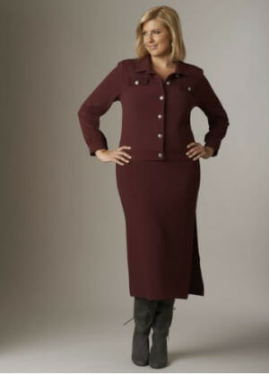Woman in burgundy denim blazer and burgundy maxi skirt with tall gray boots