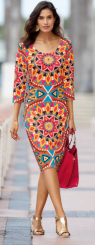 woman wearing a vibrant print patterned knee length dress and carrying red purse