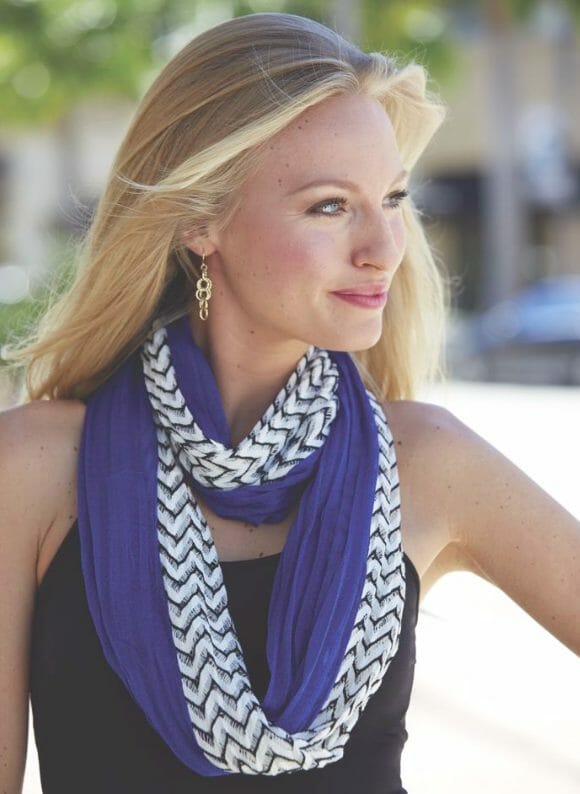 woman wearing a blue scarf with a black top