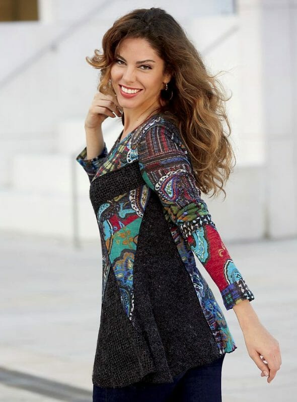 Woman in multi-color tunic and jeans