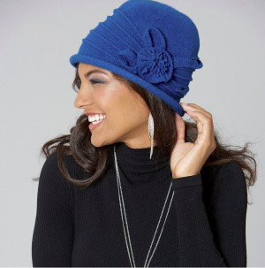 woman in a blue floral wool hat and black sweater