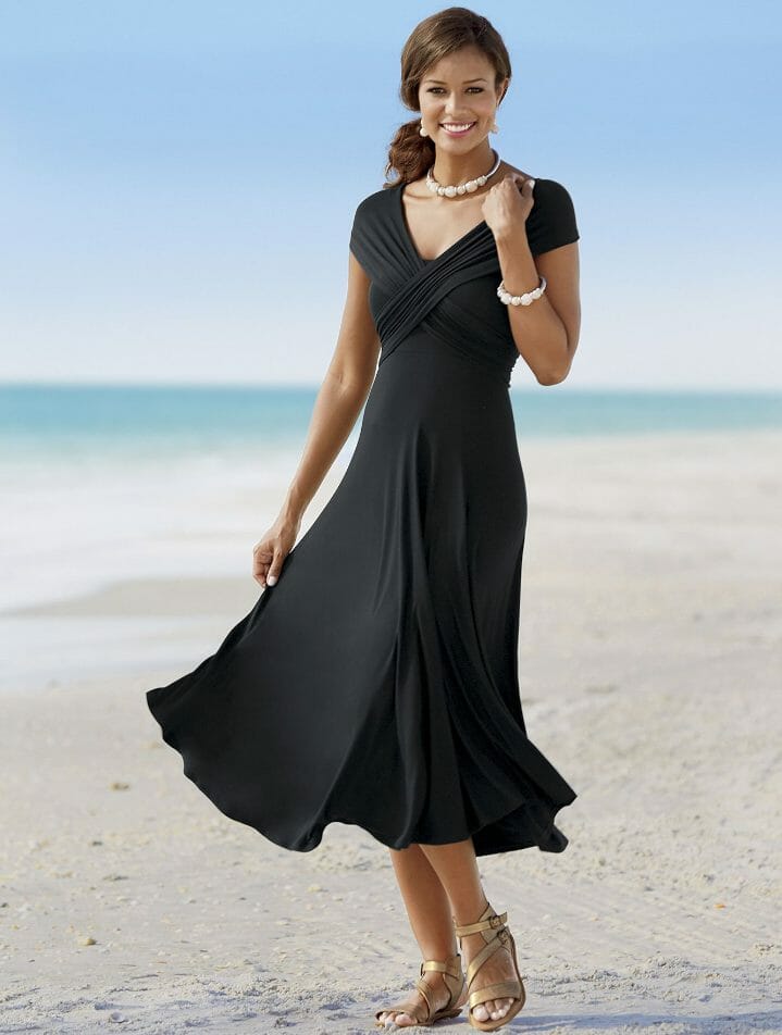 Here's an incredible style value: many looks for the price of one! Wear it as short sleeves, cap sleeves or sleeveless; halter-style, twisted straps or strapless; a dress belted at side or back, or just a skirt belted at the side. 37" long from top of bodice. Rayon/spandex; machine wash. Imported. Available only in Black.