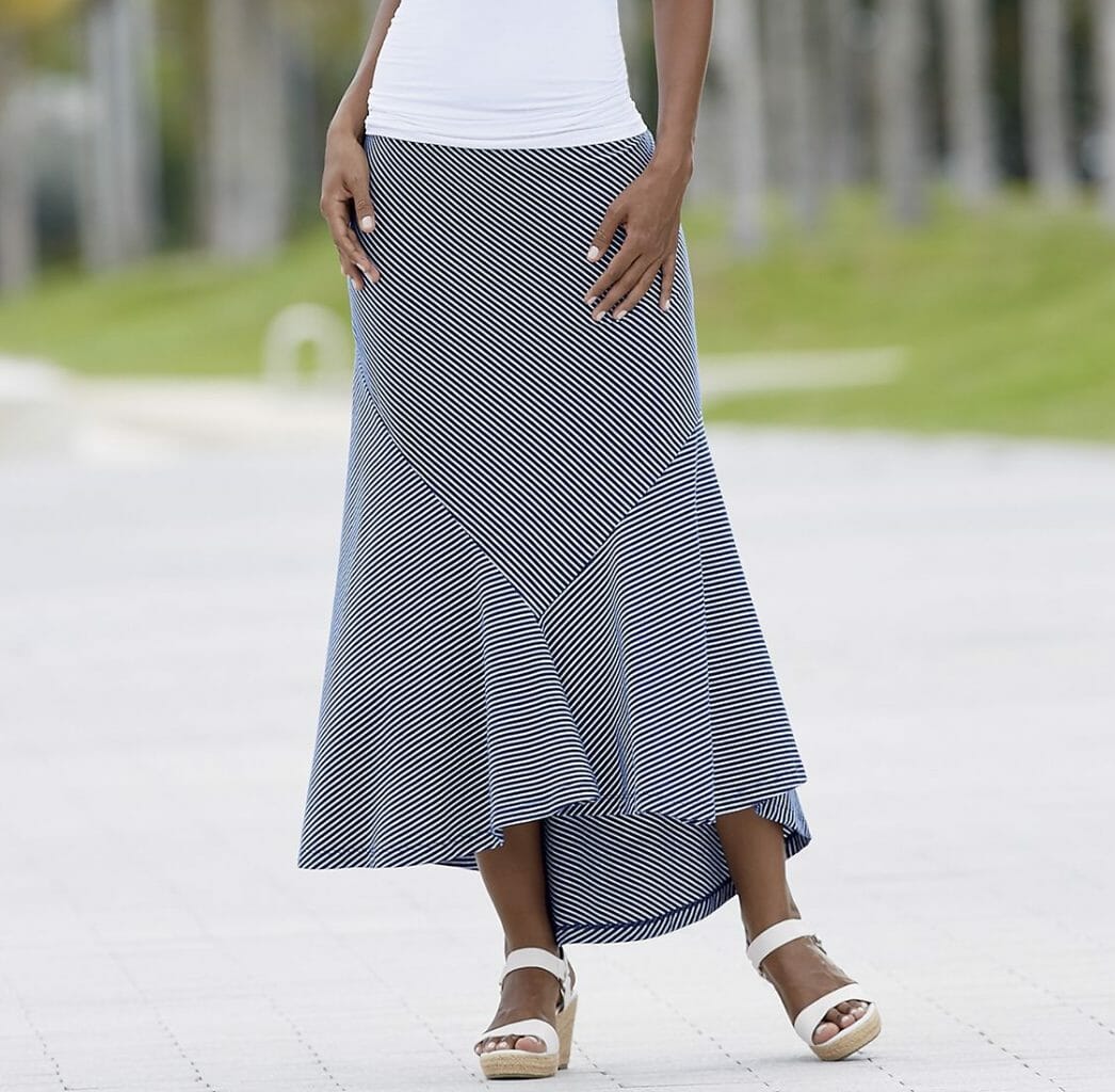 Soft, 3-paneled skirt with a fishtail hem creates graceful shape and flare. Elastic waist; 37" l. Cotton; machine wash. Imported. Available only in Blue/White.