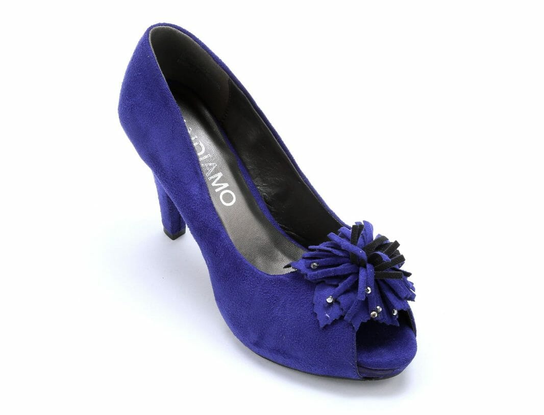 Sparkle-sequined pompom highlights the top of this faux suede purple pump.