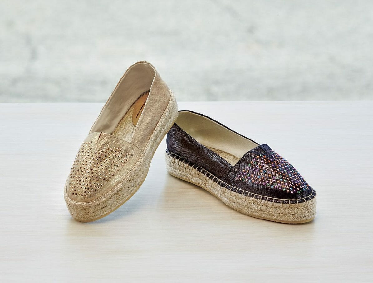 Shimmer and shine with every cushy step, in fabric uppers with studs. 1" base.