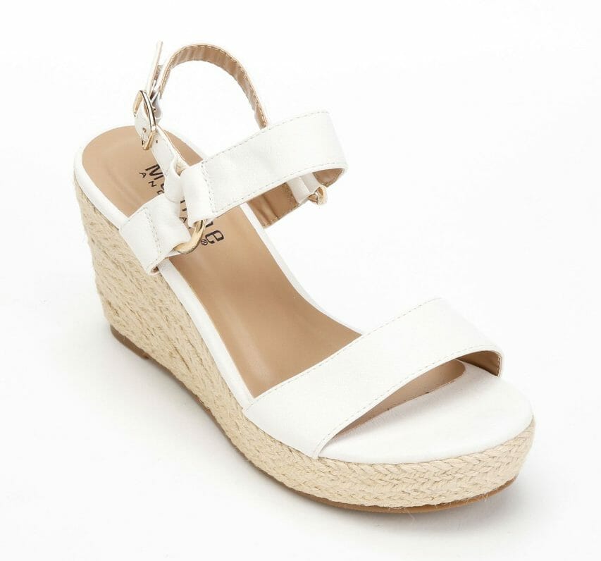 Bright, light and breezy! Take these curvy, sun-loving wedges out for an attention-getting spin. 3" wedge heel; 1" platform. Synthetic. Available only in White.