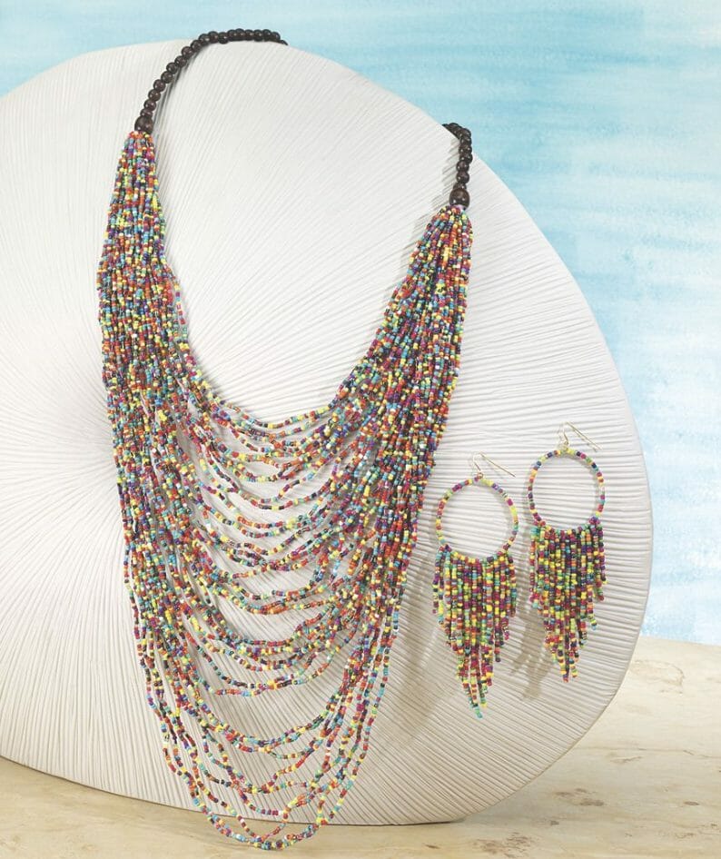 A delightful cascade of kaleidoscopic bits of color, this layered, multi-strand necklace adds a happy touch to any outfit. Necklace has 26" inside circumference.