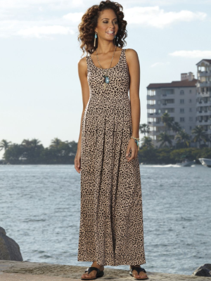 Woman weaing animal print maxi dress and brown thong sandals