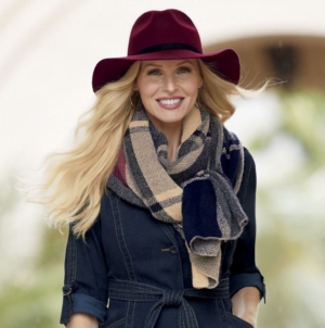 woman in denim trench-style coat with gray, blue and cream infinity scarf and burgundy hat