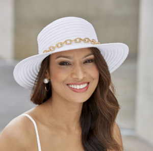 Woman in white hat with gold brim