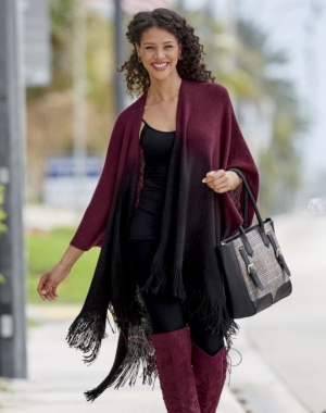 Woman in over-the-knee suede boots, black leggings, black tank and matching ombre wrap