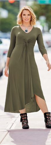 Woman in multi-colored booties and green, high-low hem and ruched front dress