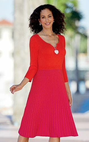 Sweater dress with ribbed-knit, pleated bodice with red top and pink and red stripe skirt