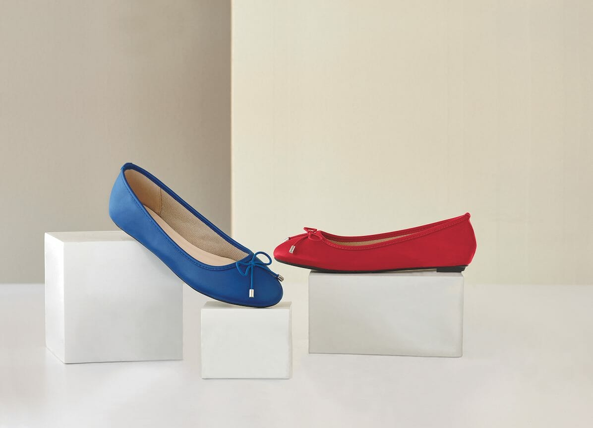 Ballet flat with decorative bow shown in red or blue