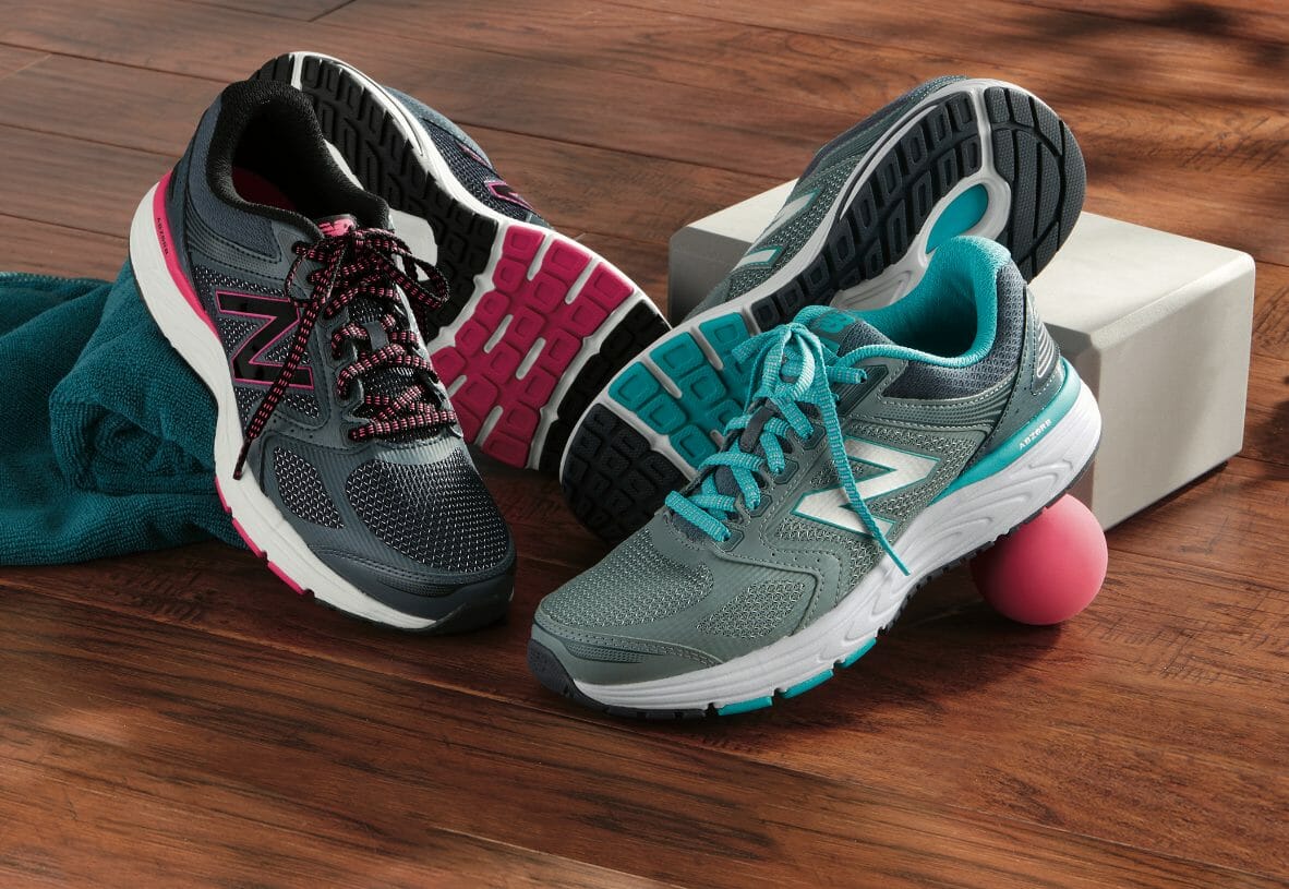 Leather and mesh upper with removeable footbed tennis shoe in pink and black or aqua and white