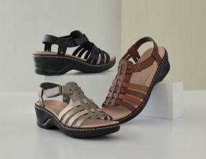 Sandal with narrow leather stripes with hook-and-loop straps and 2 1/4 inch heel