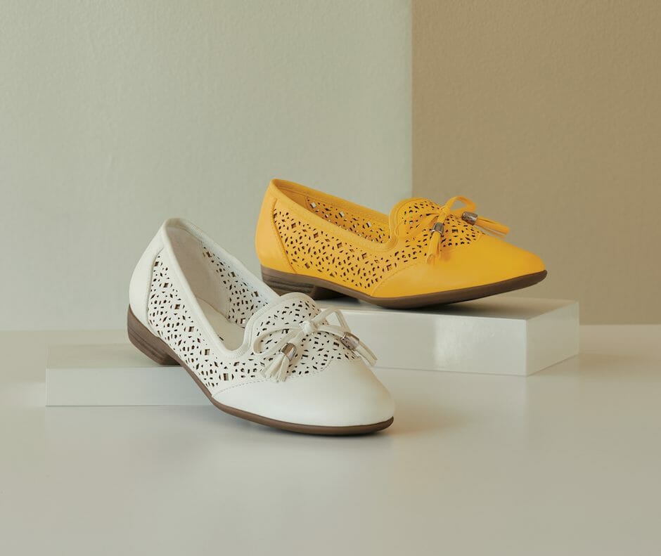 Cutouts and tassel-trimmed bow loafer available in yellow or white