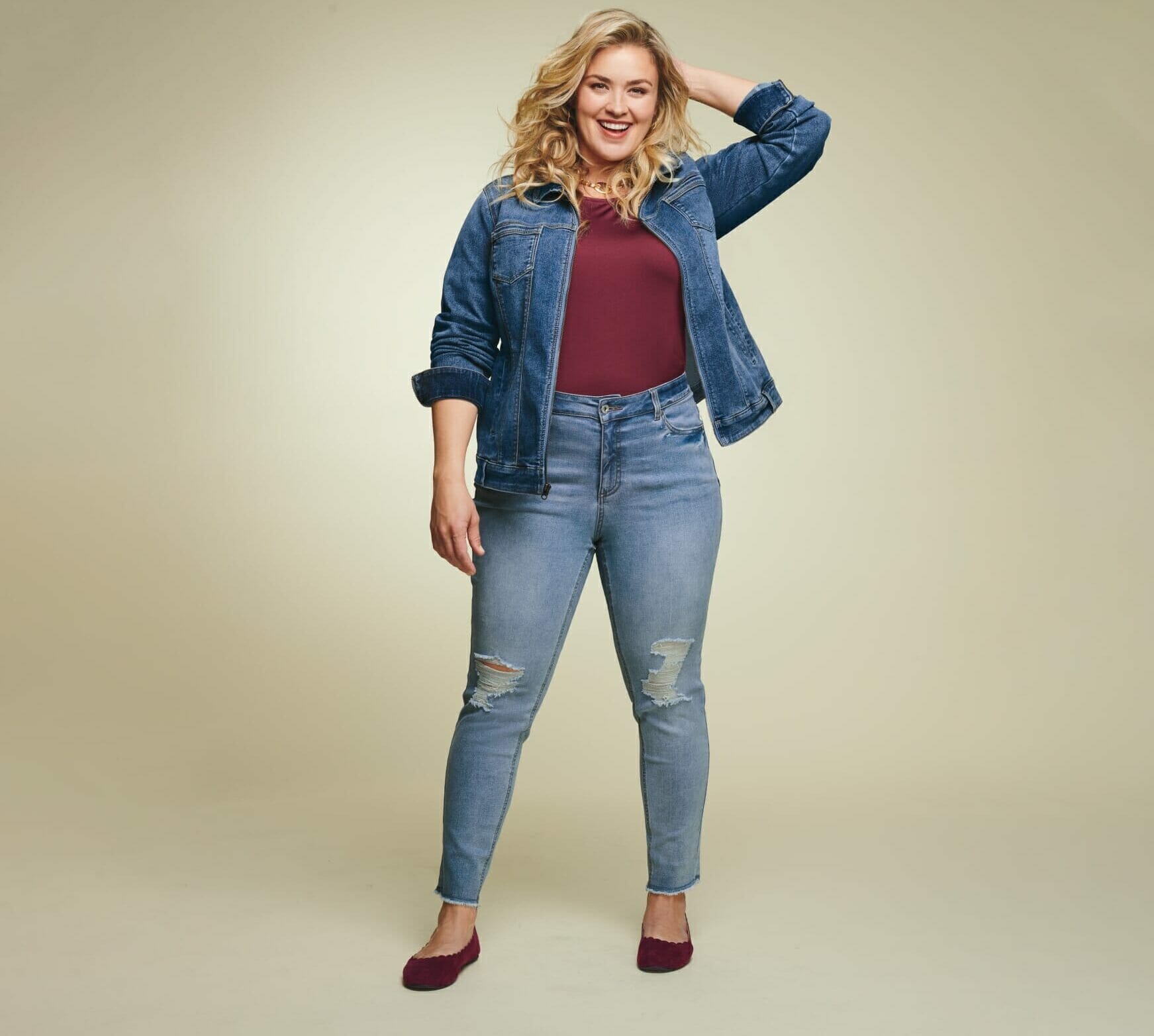 Plus size model wearing denim jeans and jacket
