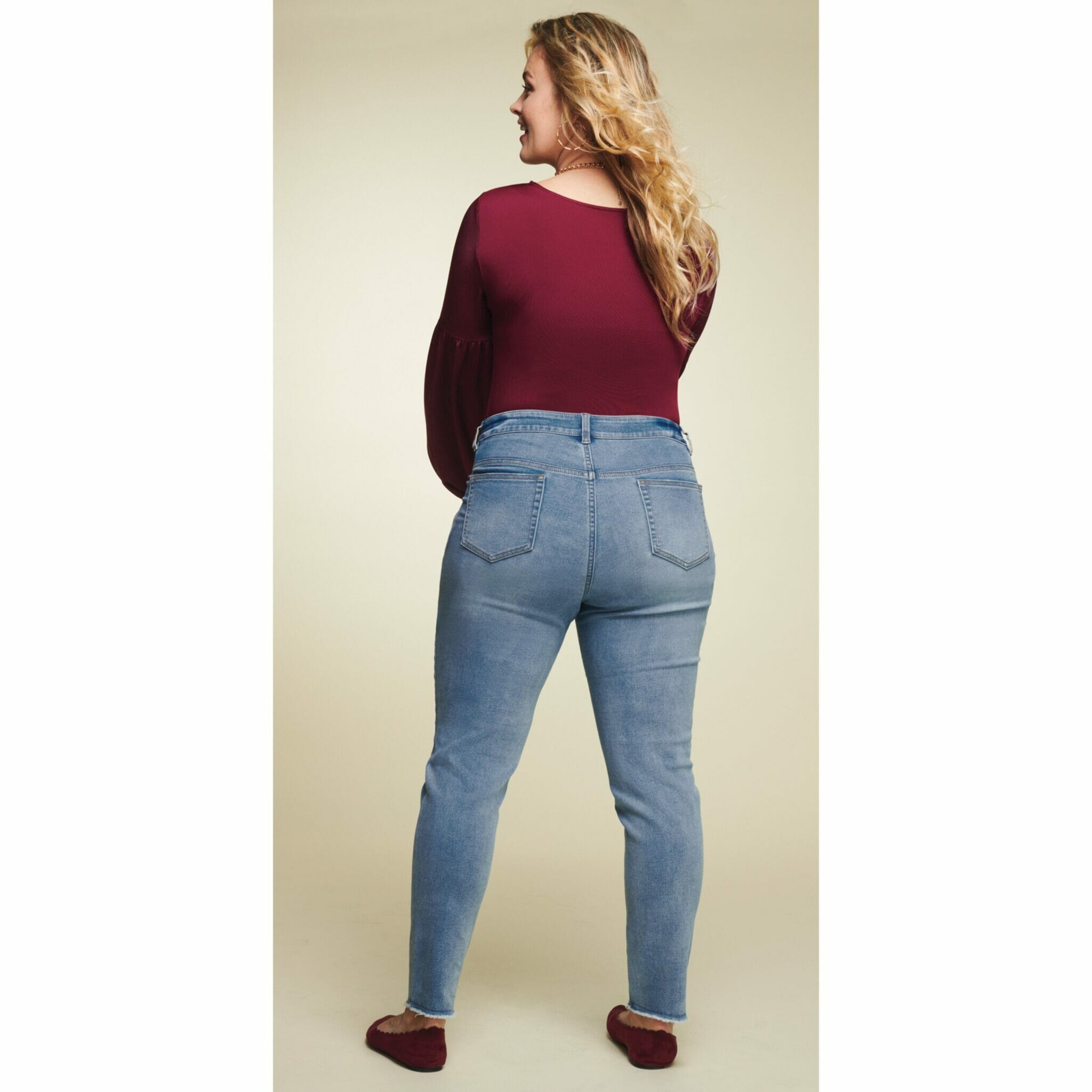 blonde plus-size model showing backside of jeans