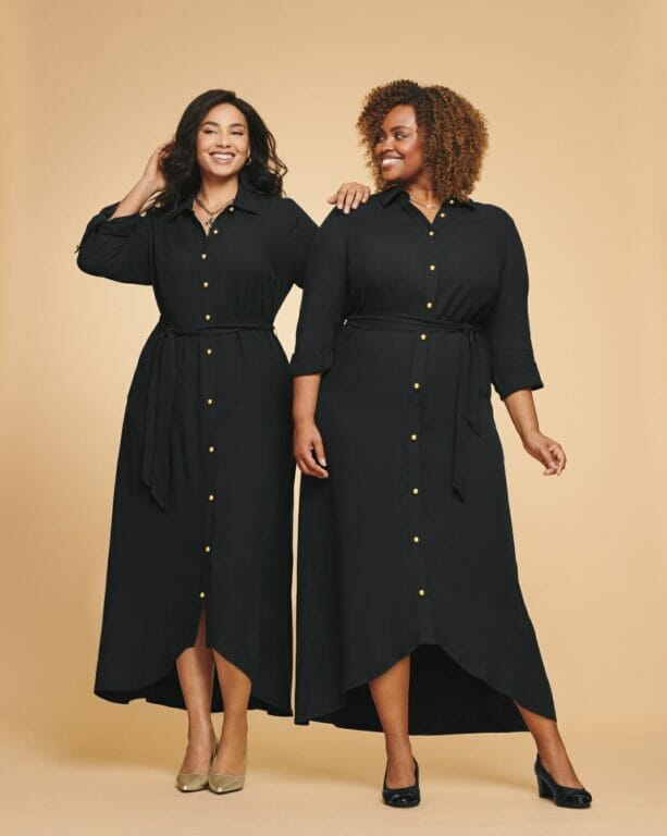 two plus-sized models wearing long-sleeve black dresses.