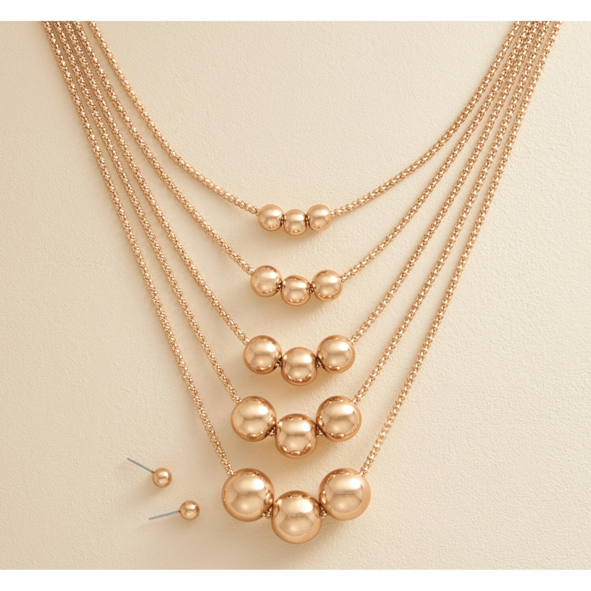 Layered gold necklace.