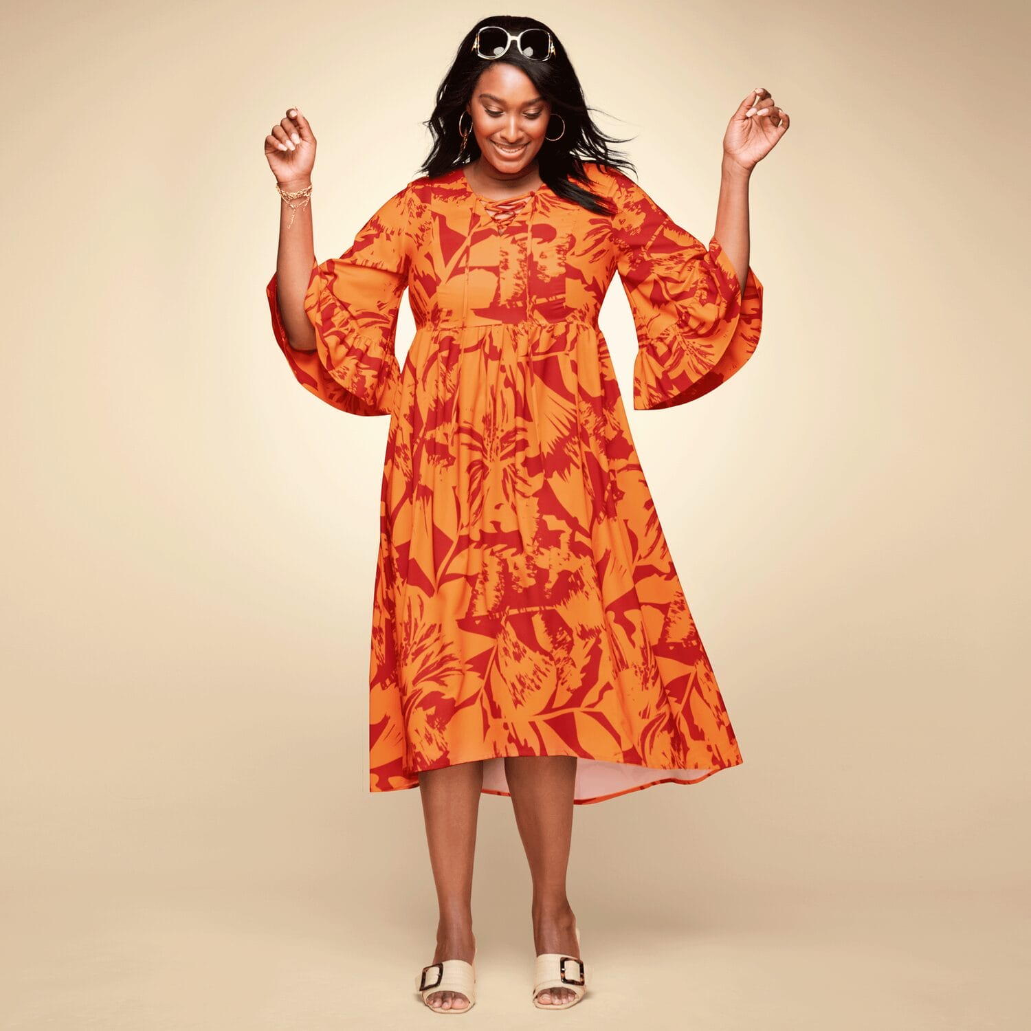 Bright empire-waist dress on african-american woman